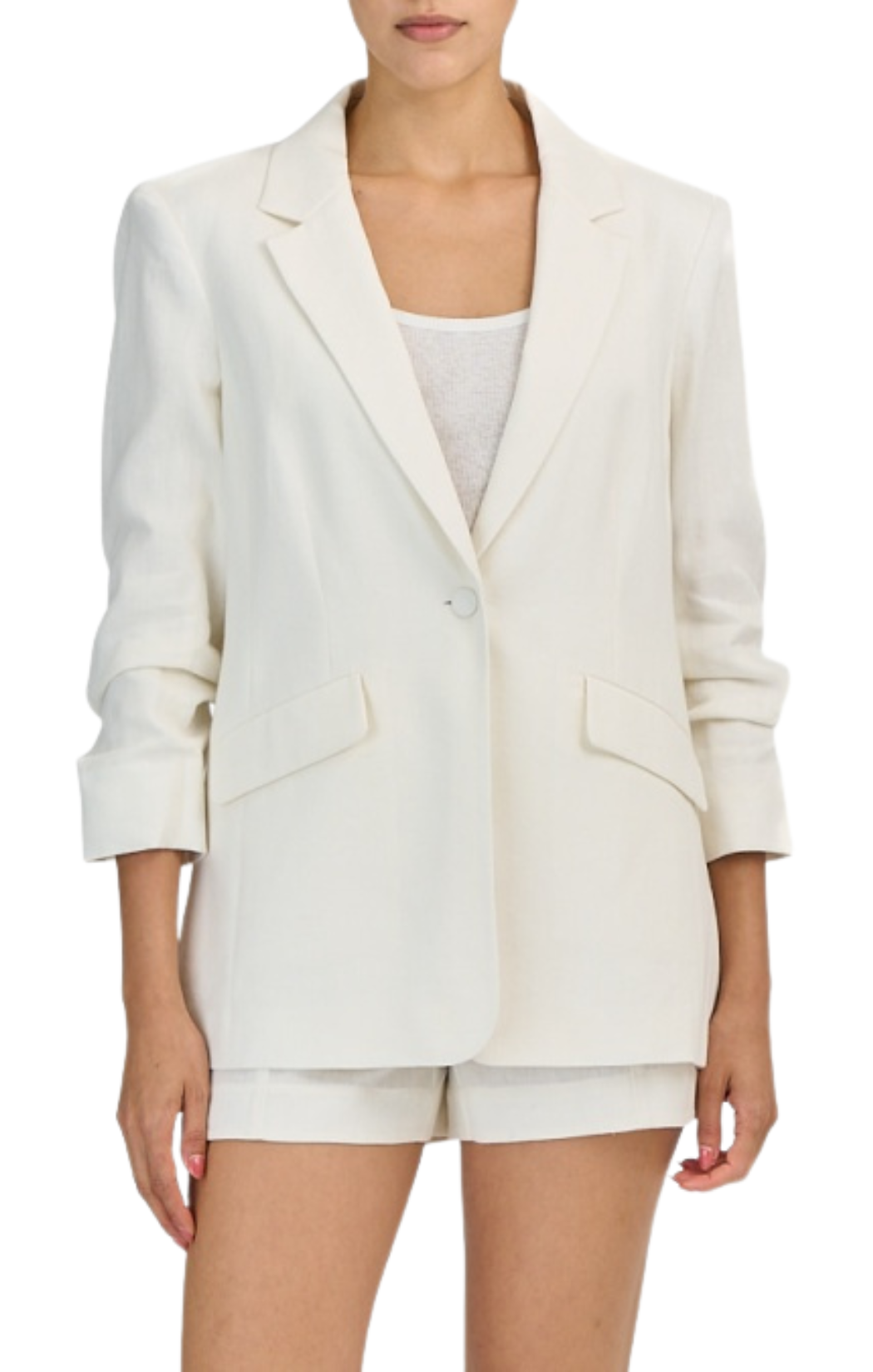 Tailored blazer silhouette with cinched arms at mid forearm. Lightweight linen suiting fabric. Ivory by Cinq a Sept.