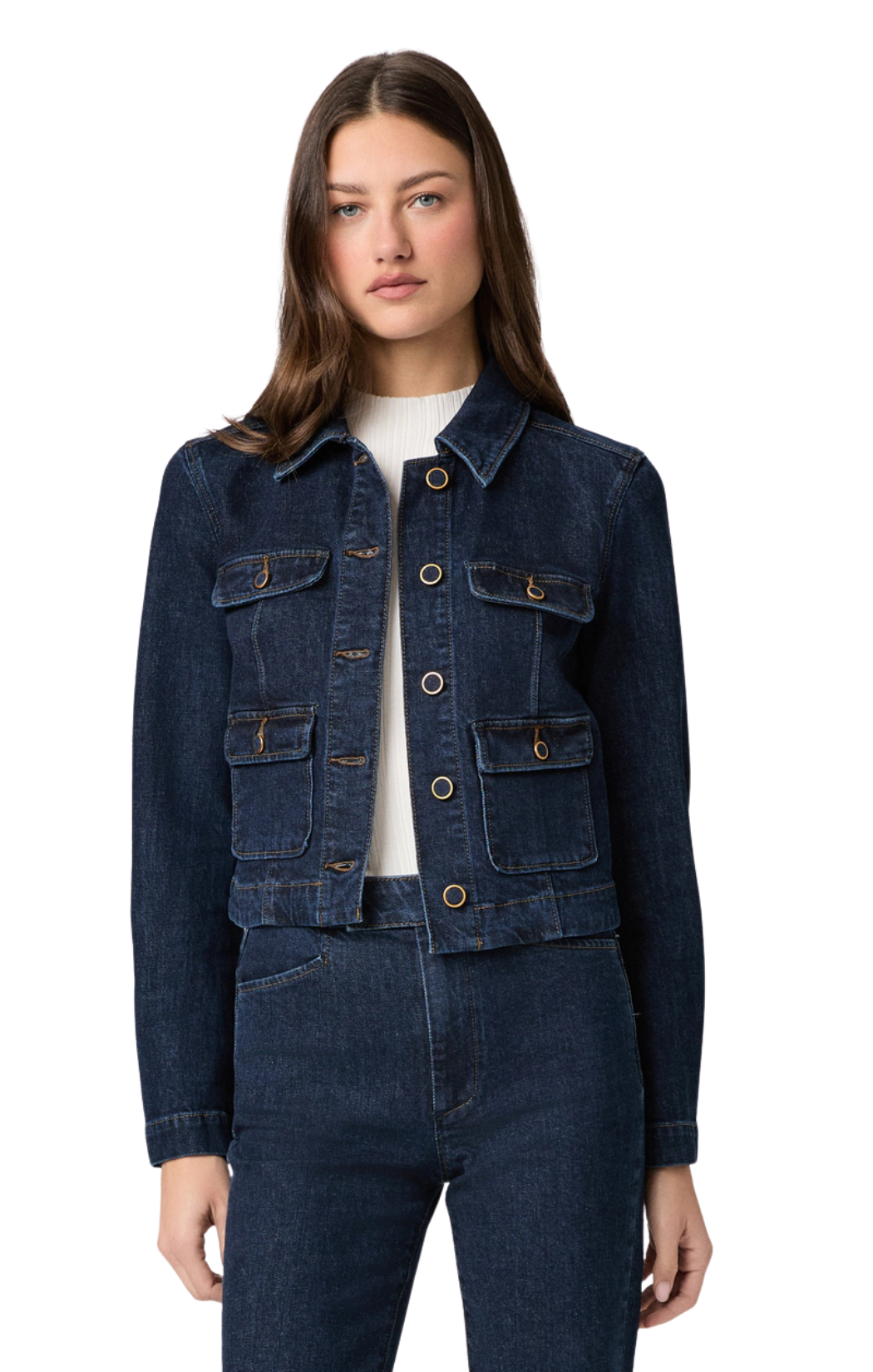 Denim jacket from Paige in a dark indigo wash with four front pockets accented with self-covered vintage gold trim buttons and brown contrast stitching