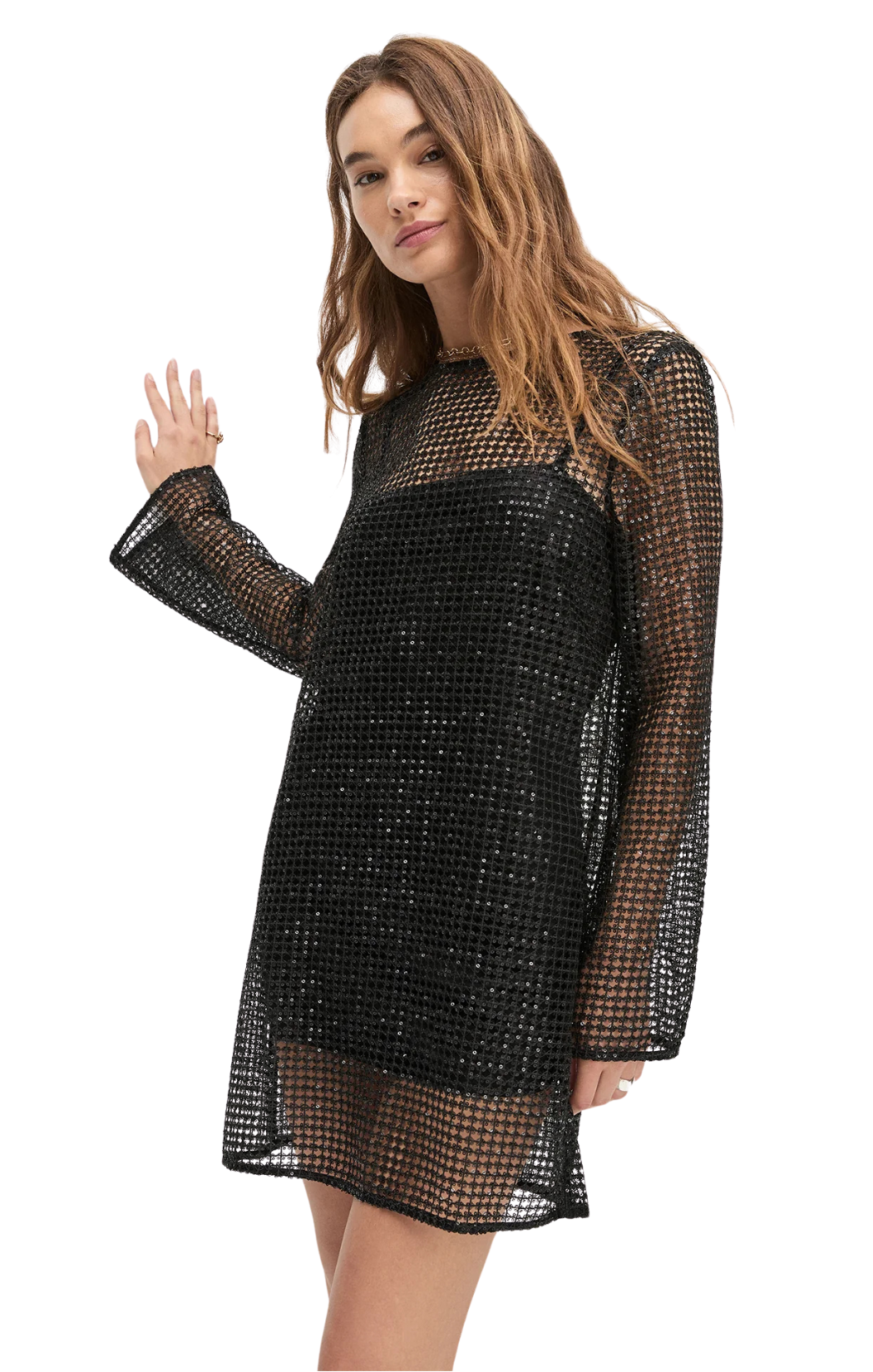 Woman wearing a black mesh dress on a white background