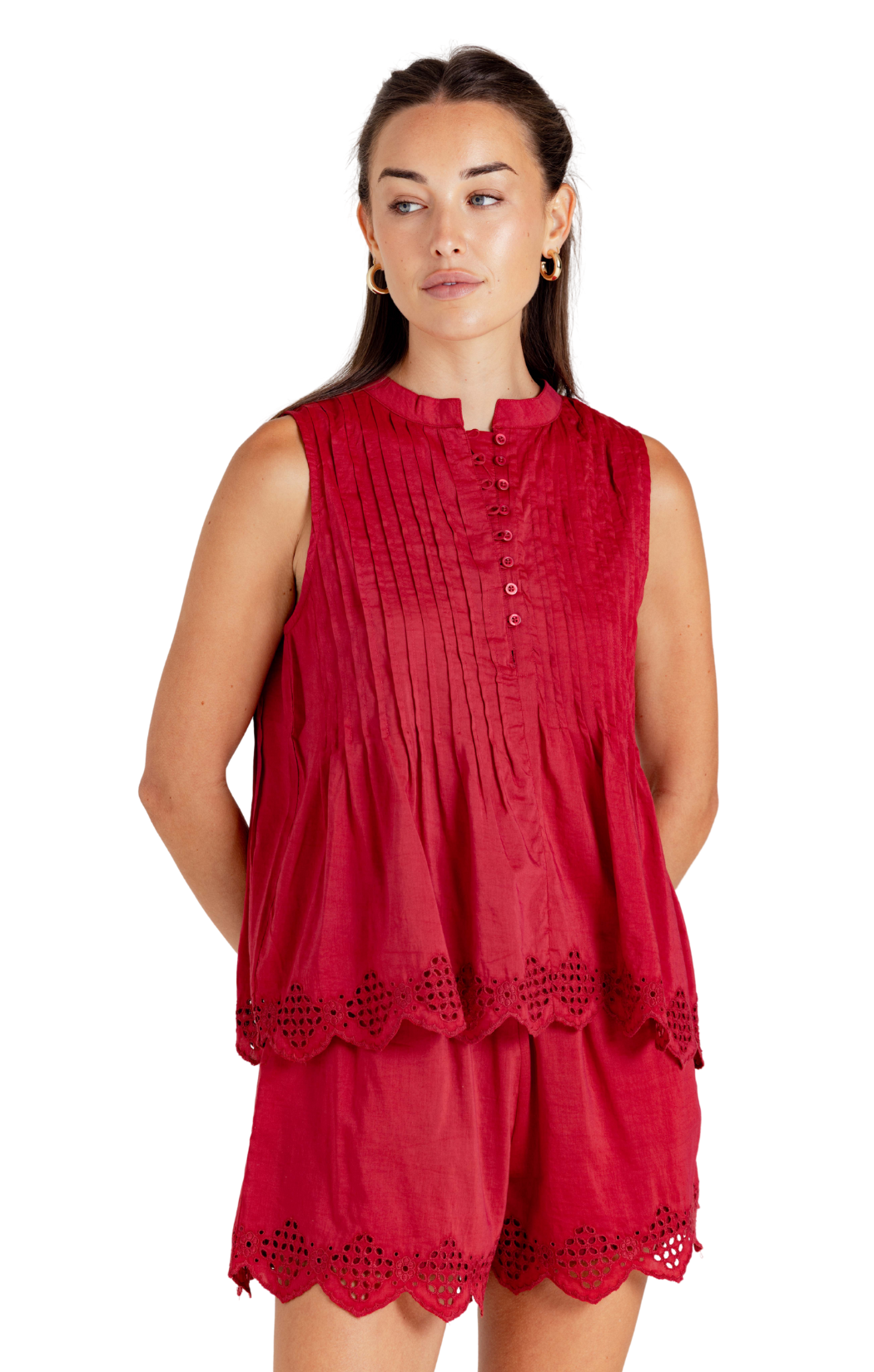 Sleeveless top silhouette in red
Pleated plaits and button detail top half
Embroidered scallop detailing
Lightweight woven fabric
80% cotton / 20% silk