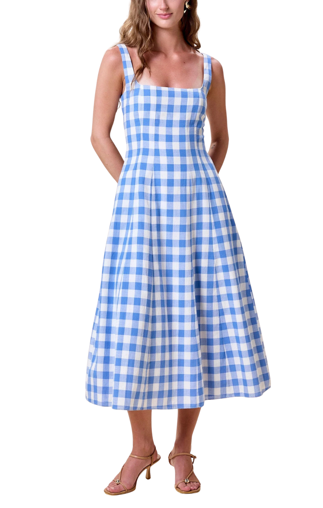 A dress in bllue bonnet gingham, a fit and flare silhouette and smocking at the back