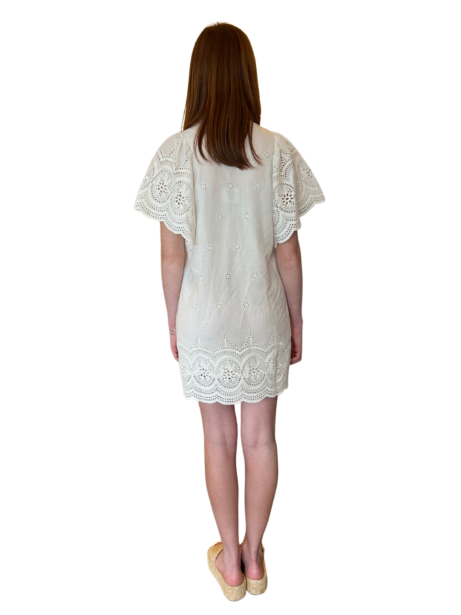 Amp up your summer style with the Angel Eyelet Dress by Bell Collectiton. Featurning&nbsp; flutter sleeves and playful tassel detailing. You'll be the belle of the beach in this unique and charming piece from Bell Collection!