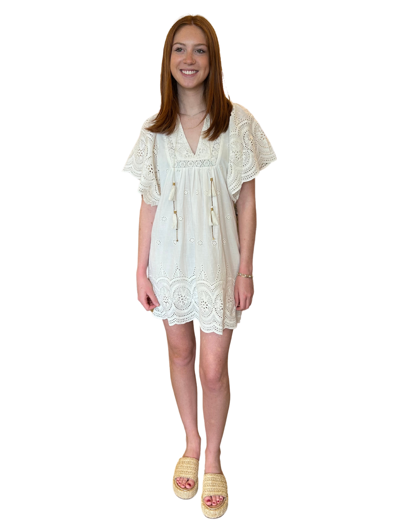 Amp up your summer style with the Angel Eyelet Dress by Bell Collectiton. Featurning&nbsp; flutter sleeves and playful tassel detailing. You'll be the belle of the beach in this unique and charming piece from Bell Collection!