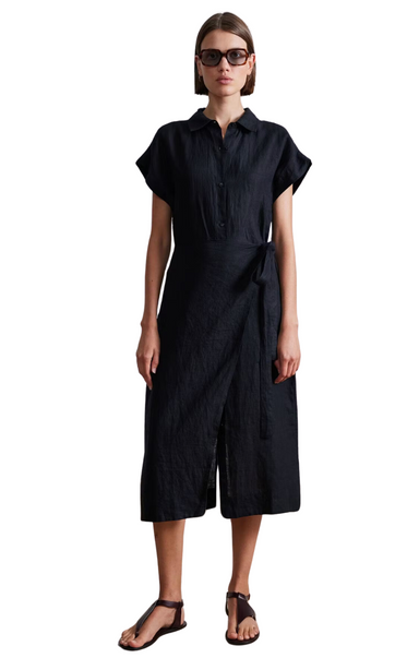 Relaxed straight silhouette, shirt collar neckline, full button placket, center back slit, overlap panel with a self tie at the waist. Black wrap midi dress.