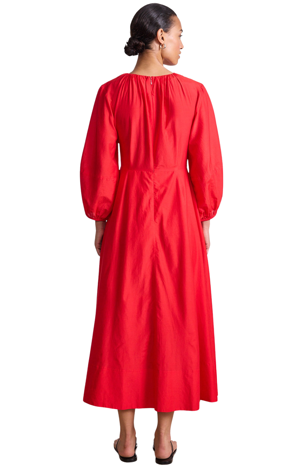 The back of a woman wearing a red dress on a white background