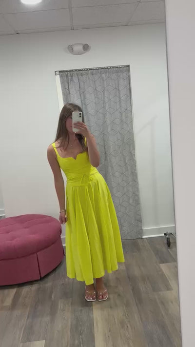 Girl facing forward in yellow dress